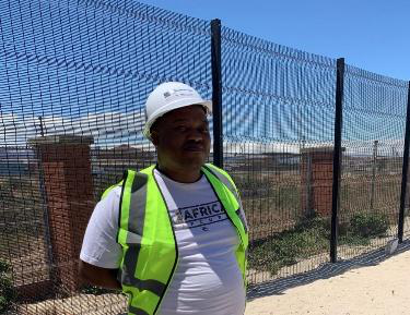 Spara team member on-site at a security fence installation